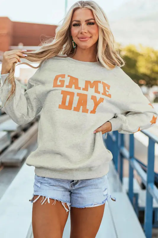 New in grapefruit orange game day graphic sweatshirt