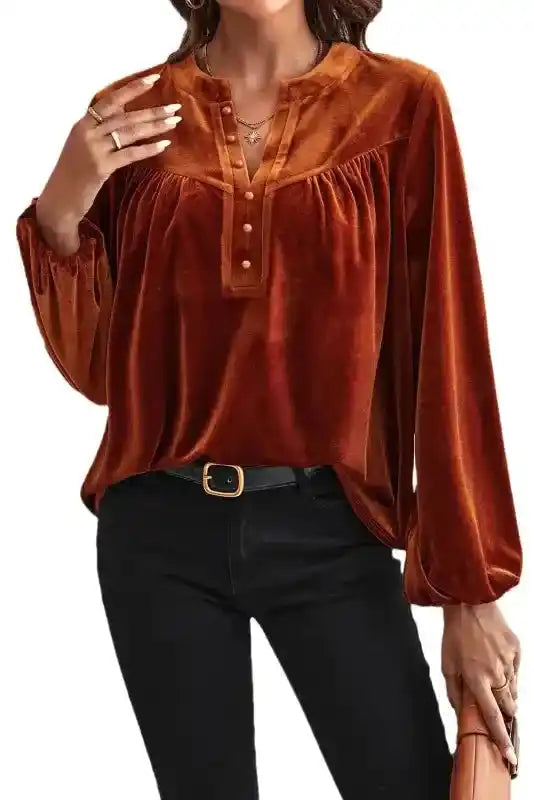Styled Gold Flame Beaded Velvet Top with black pants, perfect for winter parties or elegant evening wear.