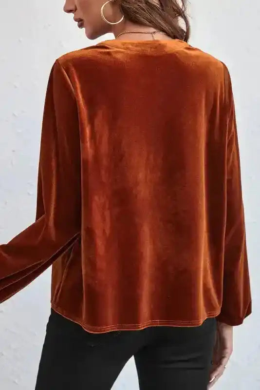 Back view of the Gold Flame Beaded Velvet Top showcasing its smooth velvet texture and relaxed fit.