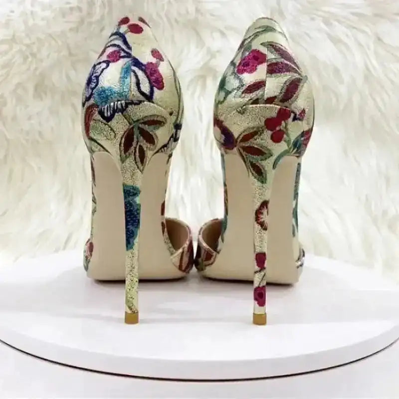 Back view of Gold Hollow Stiletto Heels – Glam Party Sandals showing slim high heels and vibrant floral embroidery.