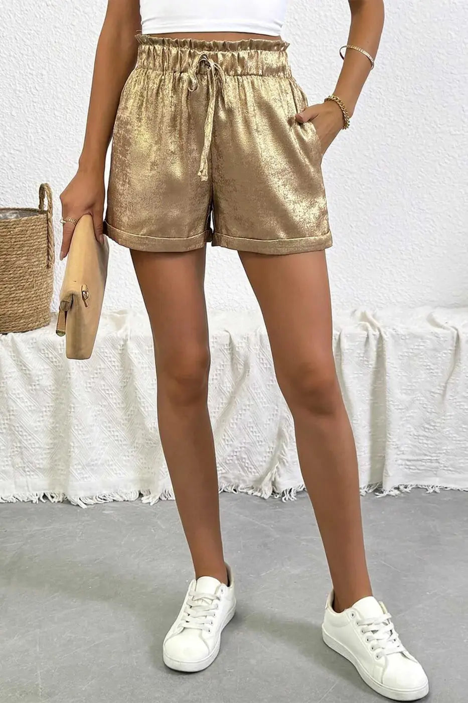 Full outfit featuring Gold Metallic Shorts Women paired with white sneakers and clutch, ideal for summer outings and casual parties.