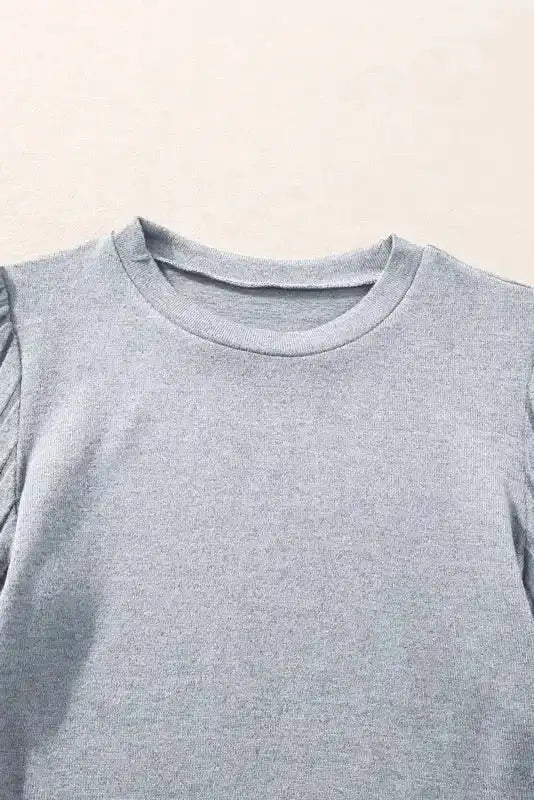 Close-up of neckline on grey Ribbed Bishop Sleeve Top, highlighting soft knit fabric and classic round collar.