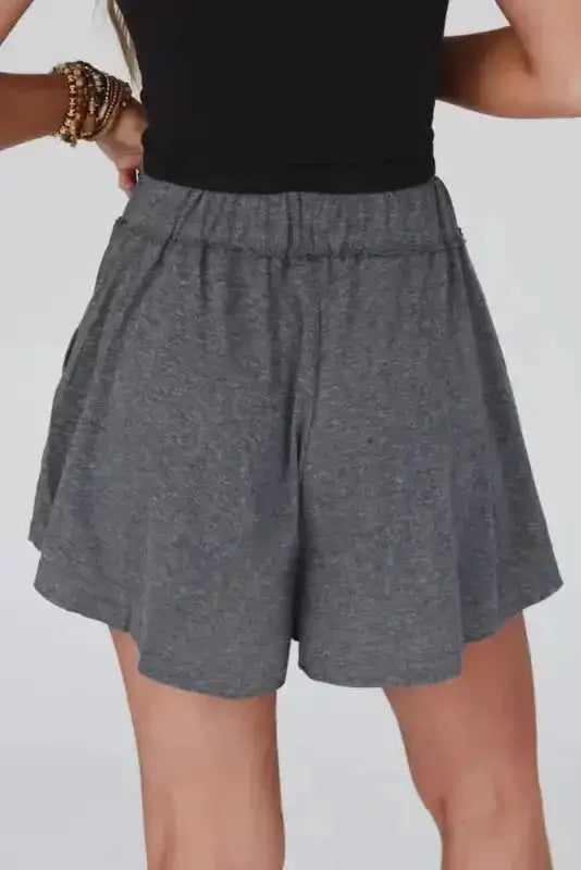 Back view of women's gray elastic waist Lambada shorts, highlighting the relaxed fit and soft fabric ideal for summer wear.
