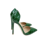 Croc-effect green stilettos with pointed toe and high heel design, perfect for elegant evening wear or special occasions in the UK.