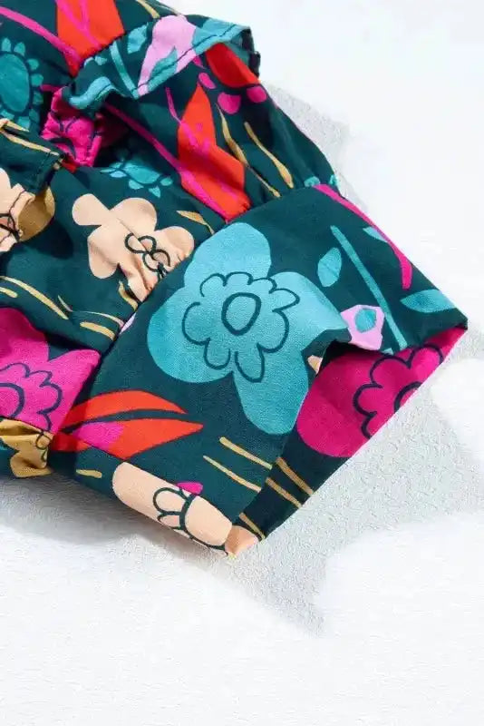 Close-up of Floral V-Neck Puff Sleeve Cotton Blouse showing frill detail and vibrant green floral print — Fashionfitz