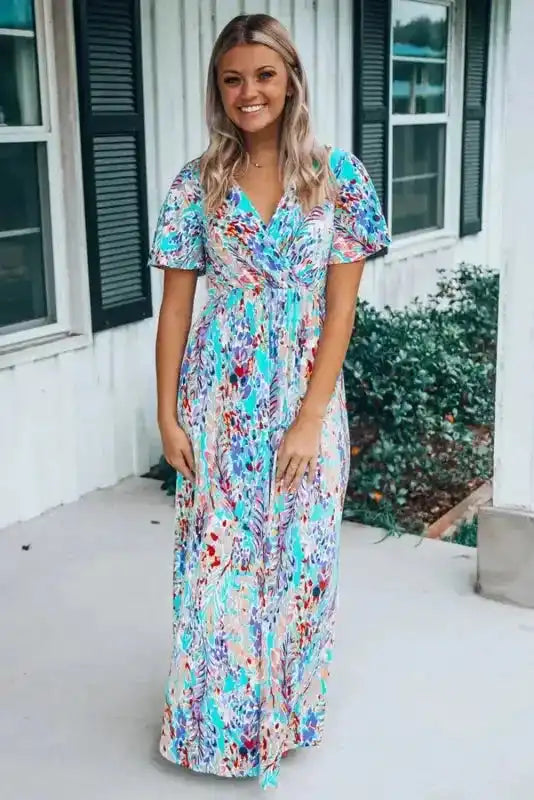 Floral Maxi Dress with V Neck in a vibrant green and multicolor print, styled with short sleeves and a flattering wrap top design.