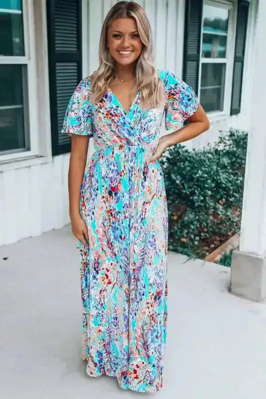 Green floral wrap maxi dress with V neckline and flowy silhouette, perfect for casual summer outings or garden parties.