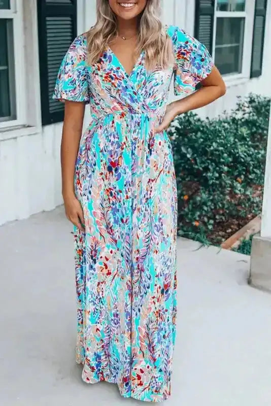 Floral Maxi Dress with V Neck in green wrap style featuring short flutter sleeves and a colorful abstract floral print, ideal for summer wear.