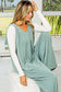 Woman in grey corded wide leg jumpsuit and undershirt for a relax relax chic look