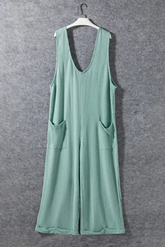 Wide leg mint green ribbed sleeveless jumpsuit with pockets on a hanger