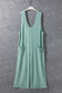 Wide leg mint green ribbed sleeveless jumpsuit with pockets on a hanger