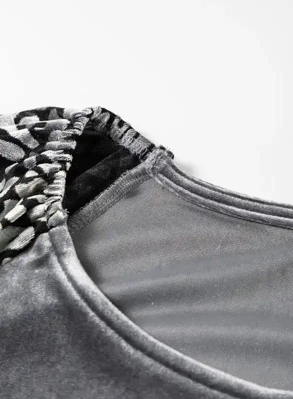 Neckline detail of Grey Leopard Velvet Blouse with contrast stitching and leopard print sleeve insert for a trendy finish.