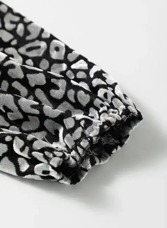 Elastic cuff of leopard print velvet sleeve, emphasizing the bold splicing detail on the Grey Leopard Velvet Blouse.