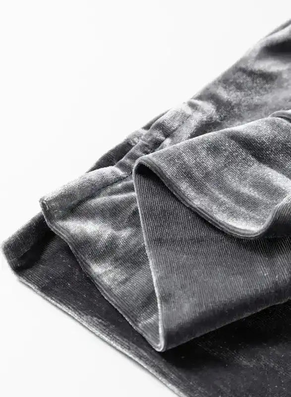 Close-up of soft grey velvet fabric, highlighting the plush texture and premium quality of the Grey Leopard Velvet Blouse.