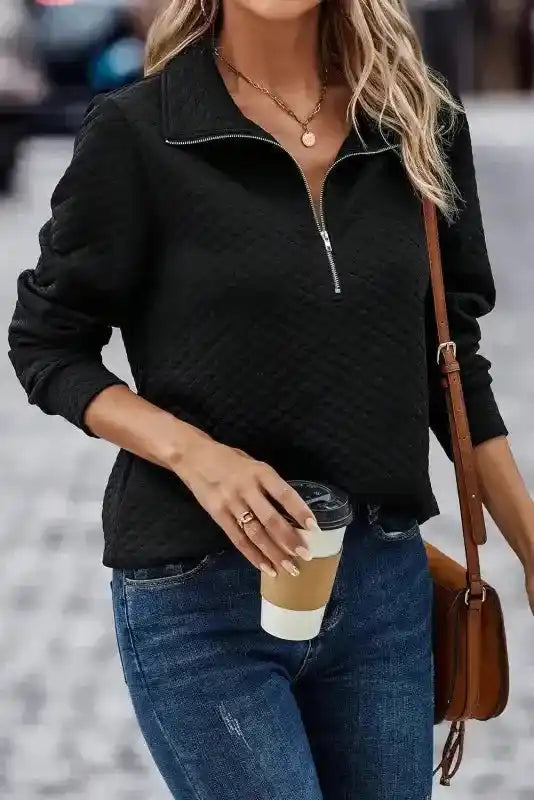 Casual street style with Half Zipper Quilted Sweatshirt - Women's Sweatshirts FashionFitz in black, styled with jeans and crossbody bag.