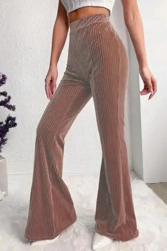 Side profile of women's high waist flare corduroy pants, highlighting wide leg cut and solid color ideal for winter and lounge outfits.