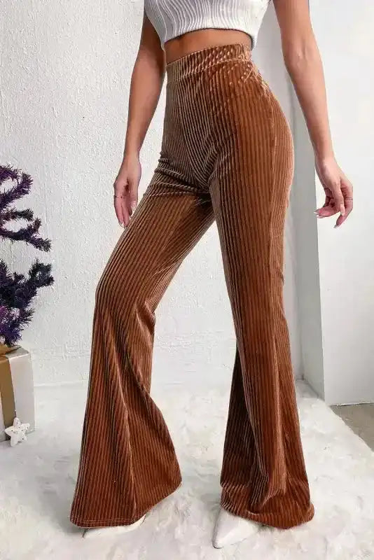 Brown high waist wide leg corduroy pants for women, styled with a cropped top, perfect for modern casual and lounge outfits.