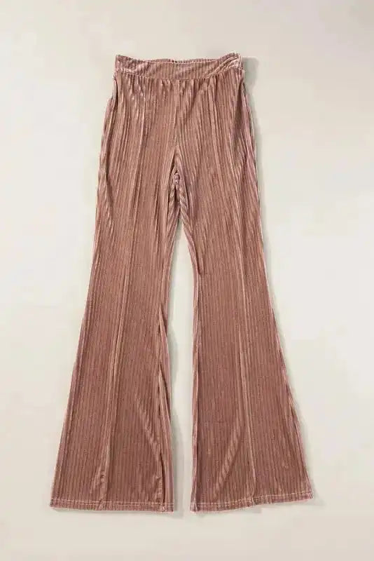 Flat lay of women's high waist flare corduroy pants in soft ribbed fabric, designed for comfort and chic winter style.
