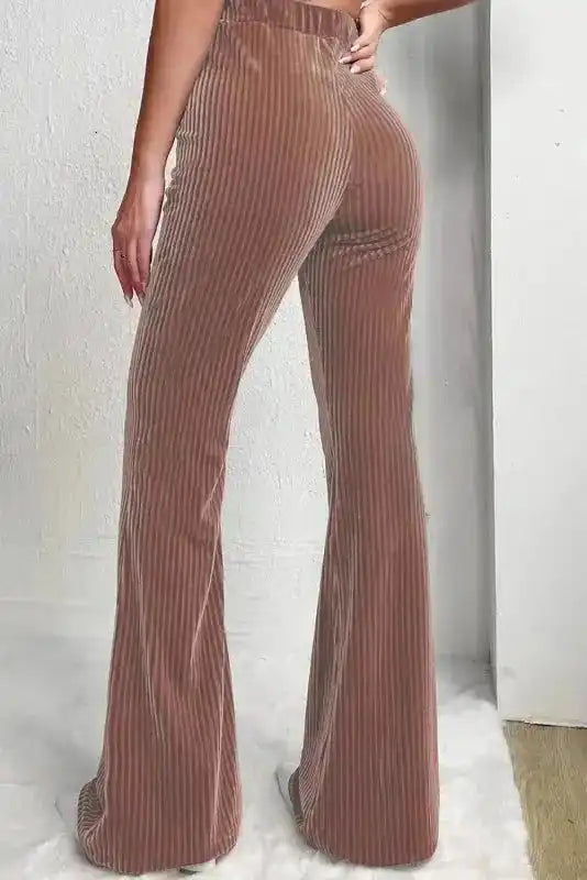 Back view of high waist flare corduroy pants for women, showcasing flattering fit and soft ribbed texture in a modern casual style.