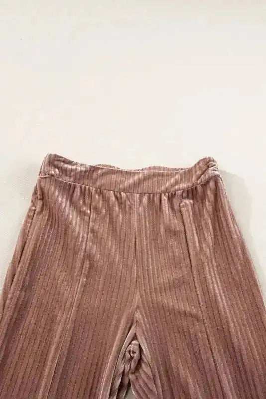 Close-up of waistband on women's high waist flare corduroy pants, showing elastic fit and ribbed texture for comfort.