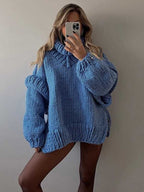 Blue fluffy chunky knit turtleneck jumper styled as a cozy oversized top, ideal for casual winter loungewear.