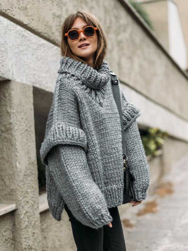 Gray fluffy chunky knit turtleneck jumper with oversized sleeves, styled for a casual and warm winter outfit.