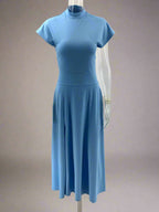 Blue dress on a mannequin against a white background