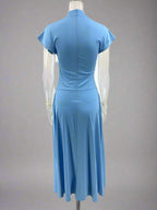 Blue dress on a mannequin against a white background