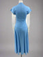 Blue dress on a mannequin against a white background