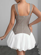 Back view of Houndstooth Slim Bubble Dress – Sleeveless Chic by FashionFitz, showcasing zip closure and structured plaid bodice with white bubble skirt.