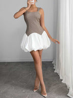 Full-length view of FashionFitz Houndstooth Slim Bubble Dress, combining classic houndstooth print with a playful white bubble hem for chic seasonal fashion.