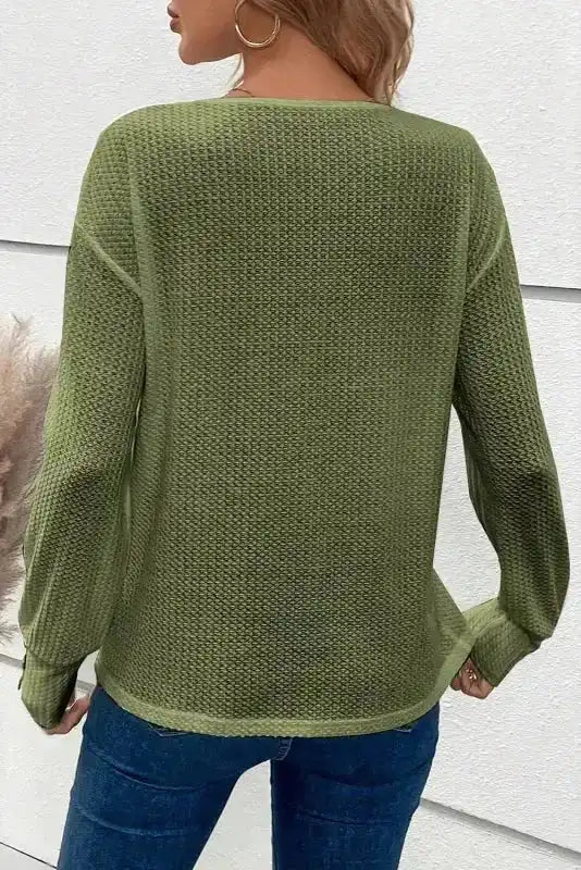 Back view of women's jungle green textured knit jumper with long sleeves and relaxed silhouette, perfect for casual wear.