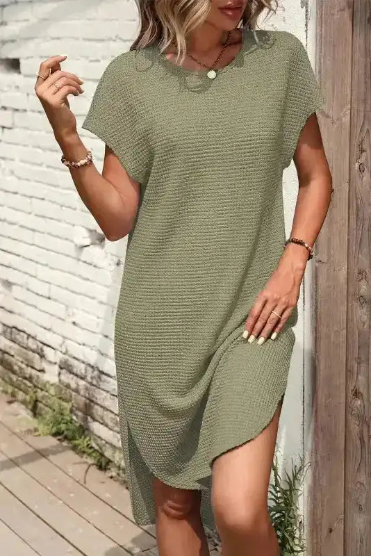 Stylish Jungle Green Waffle T-shirt Dress with curved hem and side slit, perfect for vacation or everyday casual wear.