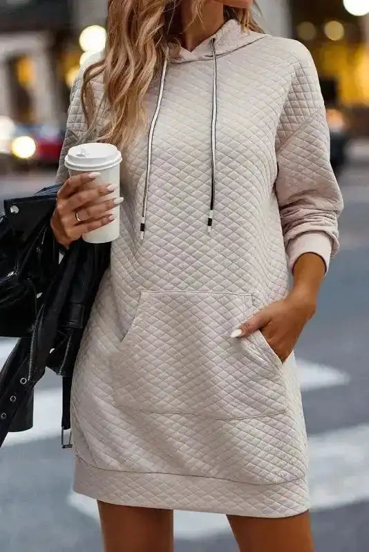Kangaroo Pocket Quilted Hooded Dress styled with leather jacket, ideal for warm and stylish street fashion.