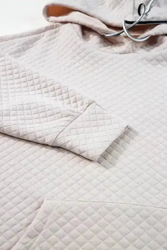 Sleeve and cuff detail of Quilted Hooded Dress - Kangaroo Pocket, highlighting craftsmanship and texture.