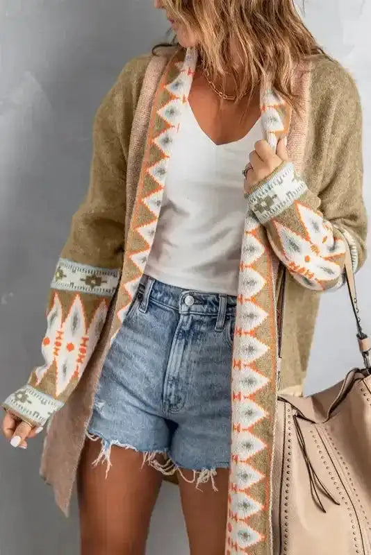 Close-up front view of Khaki Aztec Knit Duster Cardigan with open front design and vibrant orange and white Aztec trim.