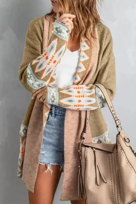 Khaki Aztec Knit Duster Cardigan paired with neutral handbag, showcasing cozy knit texture and tribal-inspired design.