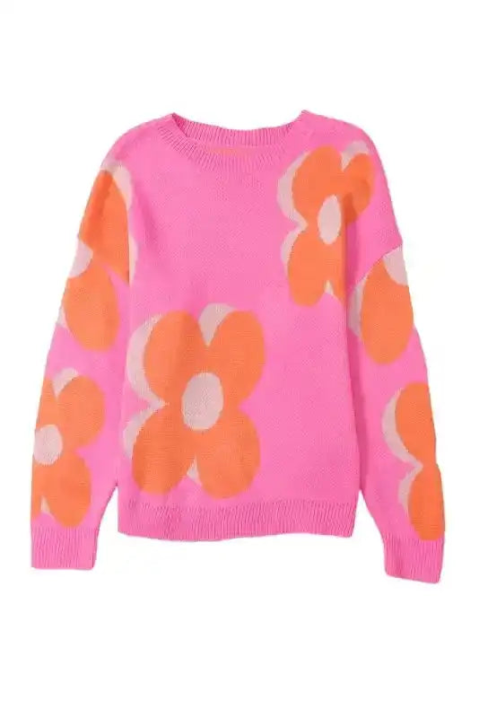 Product image of Khaki Floral Drop Shoulder Sweater with bold orange floral print on pink knit, ideal for versatile fall styling.