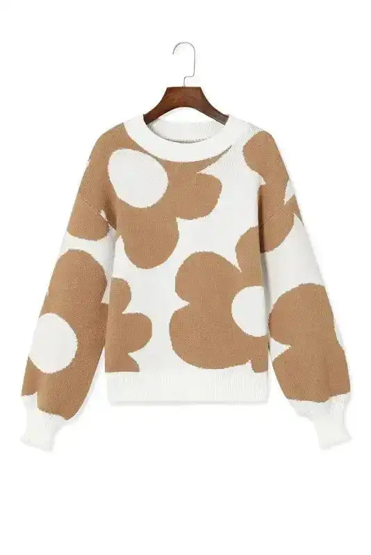 Front view of Khaki Floral Drop Shoulder Sweater on hanger, featuring bold floral print and relaxed fit for versatile styling.