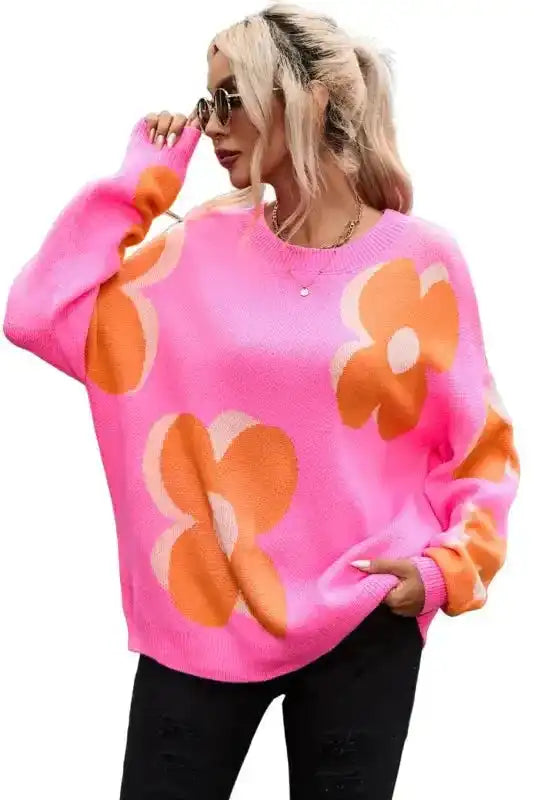 Side view of Khaki Floral Drop Shoulder Sweater worn with black jeans, showcasing oversized floral print and cozy knit texture.