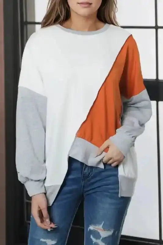 Khaki Colorblock Long Sleeve Top with orange, white, and gray patchwork, styled simply with jeans for a casual daily outfit.