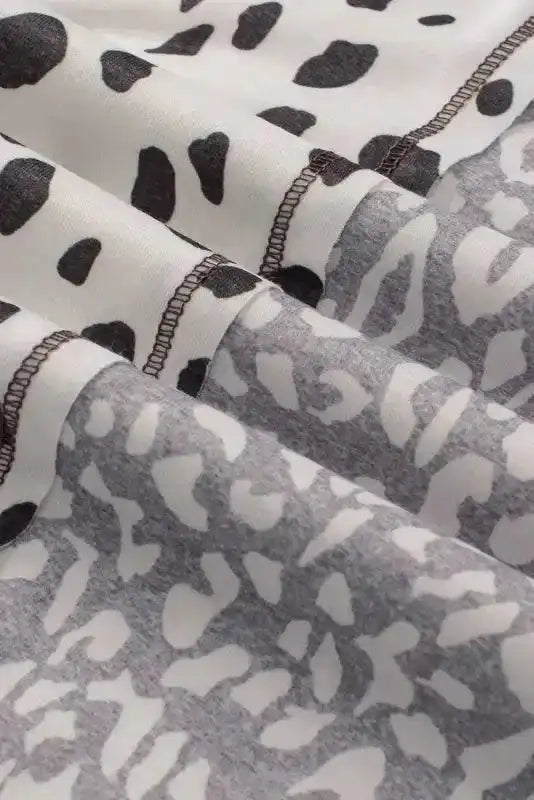 Fabric close-up of Khaki Plus Size Leopard Print Colorblock V Neck T Shirt showing contrasting leopard prints and seam detail.