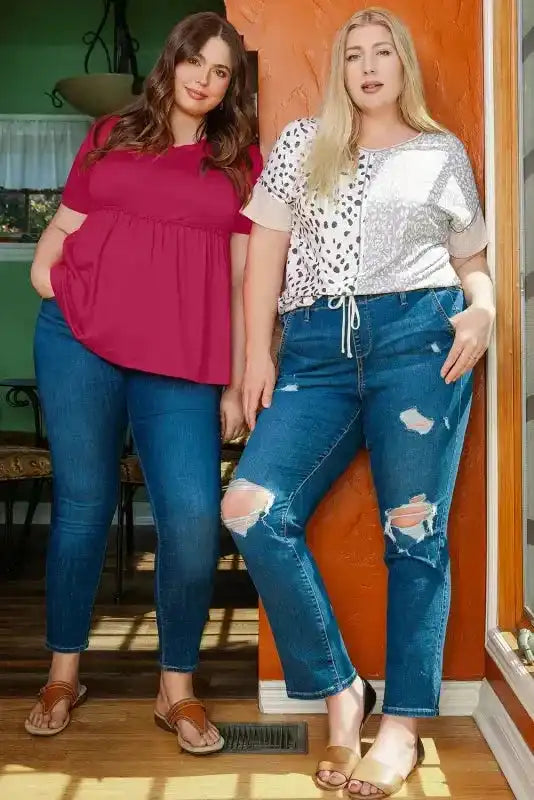 Two women modeling plus size outfits, one wearing Khaki Plus Size Leopard Print Colorblock V Neck T Shirt with distressed jeans.