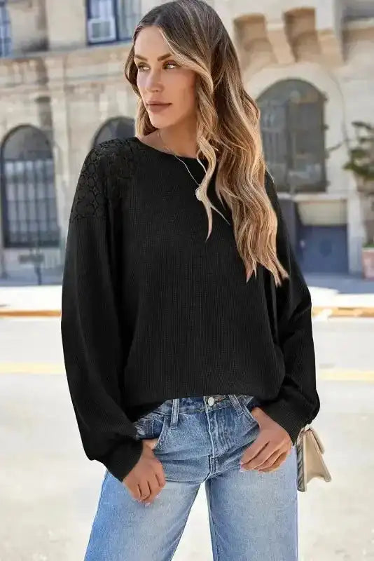 Elegant Black Lace Sleeve Textured Top styled for fall, featuring solid color and delicate lace shoulders for a chic look.