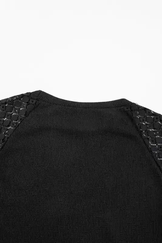Detailed back view of Black Lace Sleeve Textured Top showing lace shoulder inserts and ribbed fabric texture.