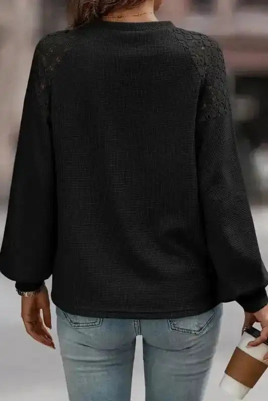 Back view of Black Lace Sleeve Textured Top highlighting lace shoulder accents and relaxed fit, ideal for daily autumn wear.