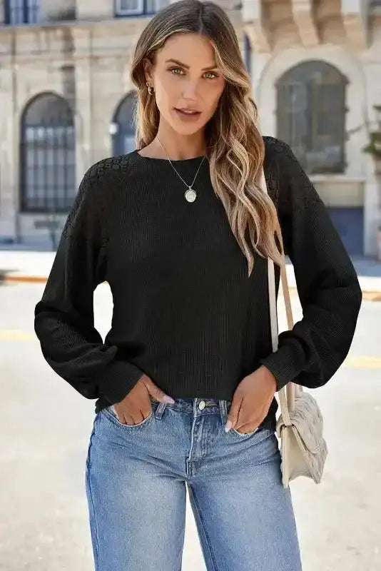 Model wearing Black Lace Sleeve Textured Top with jeans, perfect for casual outings or stylish fall ensembles.