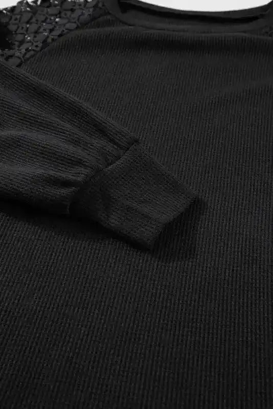Sleeve and cuff detail of Black Lace Sleeve Textured Top, featuring ribbed knit and soft, elegant finish.