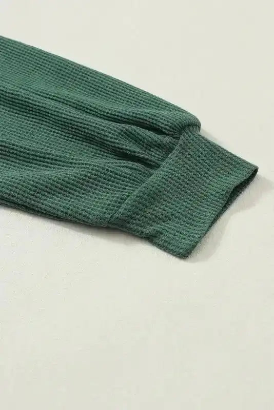 Close-up of green textured sleeve cuff on Lace Sleeve Textured Top | Women Tops | FashionFitz, showcasing waffle knit fabric.