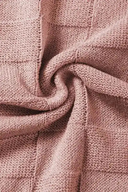 Detailed fabric swirl of blush pink Lattice Short Sleeve Sweater by FashionFitz, showcasing the soft checkered knit texture.